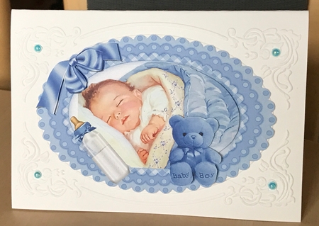 sweet baby in blue with cuddly toy A5 by Ulla Skraedderdal