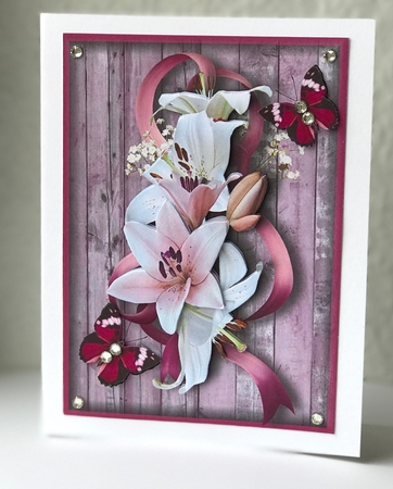  lilies and butterflies in pink by Ulla Skraedderdal