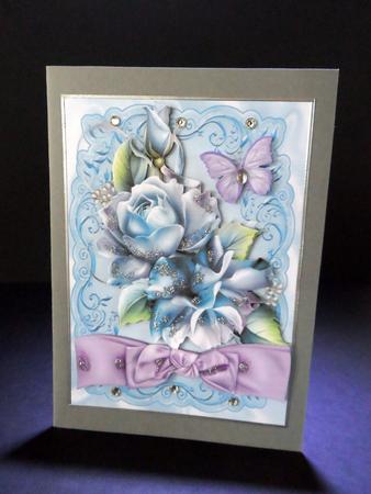 Blue Roses with Lilac Bow and Butterflies by Ulla Skraedderdal