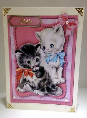 Two Adorable Kittens in There Bows. by Ulla Skraedderdal