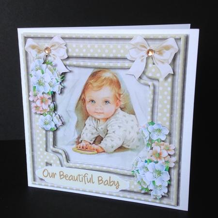 A Sweet Baby in Neutral Colours  by Ulla Skraedderdal