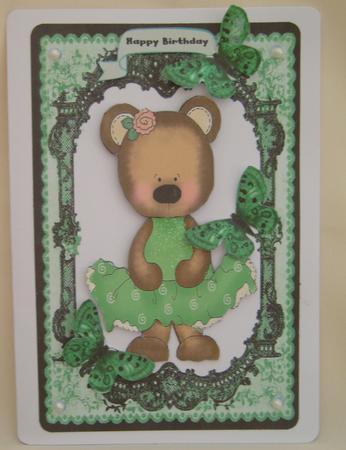 Cute Bear in Green Dress in Lovely Lace Frame by Valerie Cuthbertson