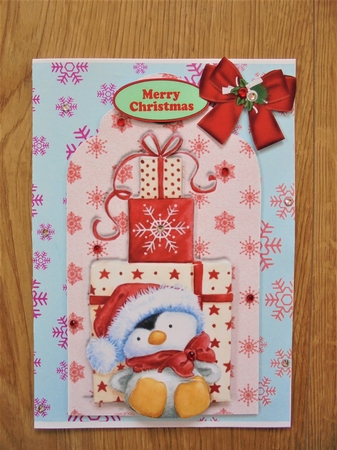 cute penguin in santa hat with presents on a tag by Valerie ODonnell