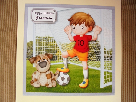 Football boy with dog by Valerie ODonnell