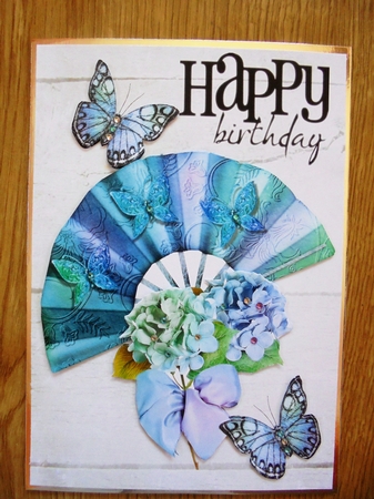 pretty blue rainbow fan with flowers and butterflies A5 by Valerie ODonnell