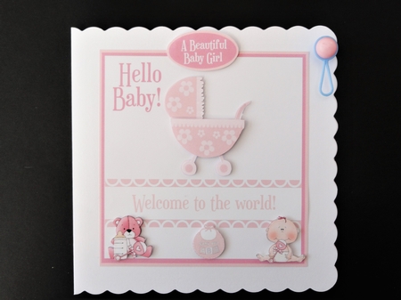 New baby girl card with pram, teddy, baby and bib. Choice of sentiments by Valerie Spowart