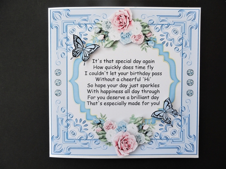 Blue floral frame with birthday verse and optional butterflies by Valerie Spowart