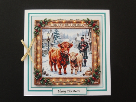 highland coos and piper by Valerie Spowart