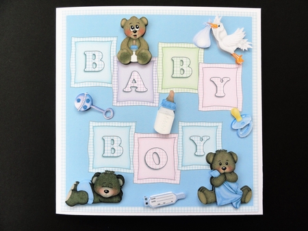 Baby Boy card with baby teddies, rattle, dummy, bottle. stork & name tag by Valerie Spowart