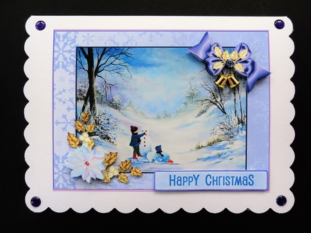 Building a snowman with White poisettia by Valerie Spowart