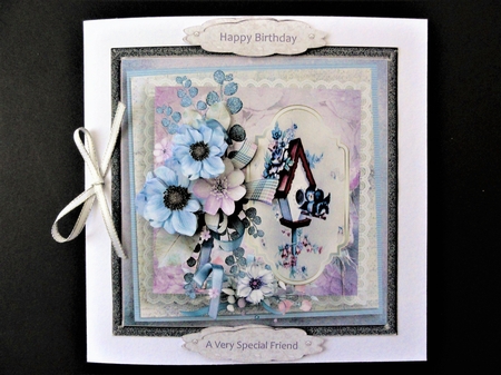 A birds new home with flowers by Valerie Spowart