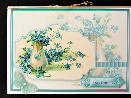 Blue flowers in vase by Valerie Spowart
