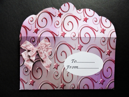 Mauve swirl embossed effect wallet with bow and flowers by Valerie Spowart