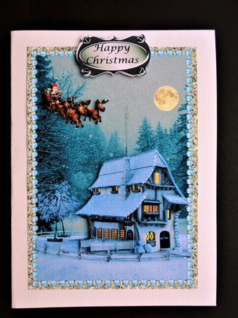 Santa flying at full moon over Cottage by Valerie Spowart