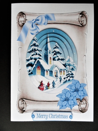  church in the snow with blue poinsettias on a scroll oval pyramids by Valerie Spowart