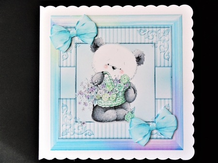 cute little panda with flowers and turq  bows in rainbow frame 8x8 by Valerie Spowart