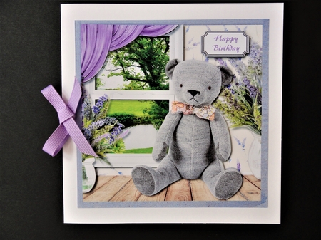 Cute teddy on window sill with lovely river view by Valerie Spowart