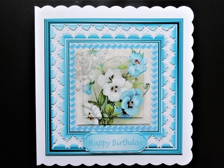 Pretty blue pansies with pearls lace in 7x7 frame with pyramids by Valerie Spowart