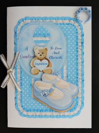 A baby boy and a baby girl toppers grandparents by Valerie Spowart