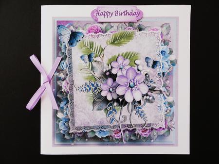 Pretty Shades of Pink/blue Flowers with Butterflies on Lace by Valerie Spowart