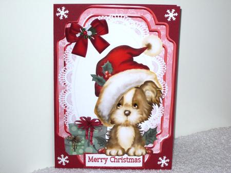 Cute Puppy with Presents in Santa Hat by Wayne Swan