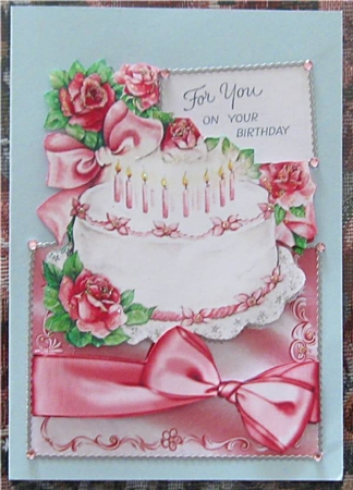 Pretty Roses on a Birthday Cake, Over the Edge by Wendy De Winter