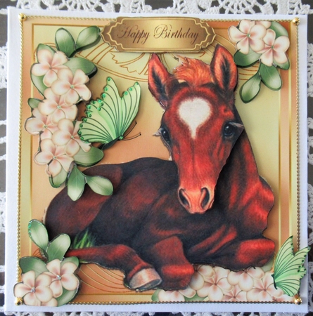 Pretty Foal Laying Down with Flowers& Butterflies 8x8 by Wendy De Winter
