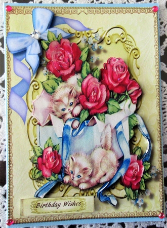 Kitties Playing in a Box of Roses  by Wendy De Winter
