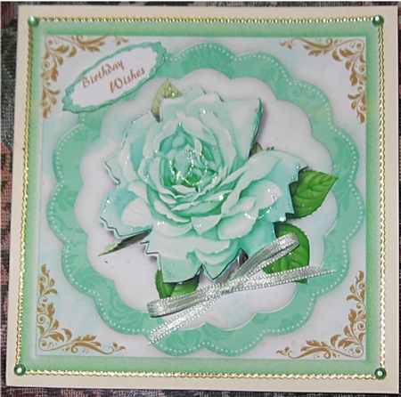 Beautiful Aqua Rose on a scalloped mat  by Wendy De Winter