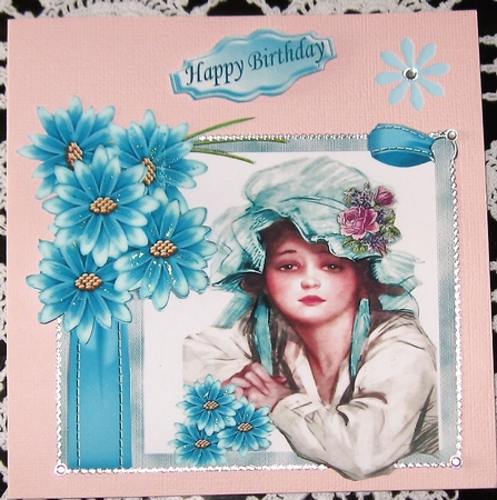 pretty vintage lady in bonnet with turq flowers by Wendy De Winter