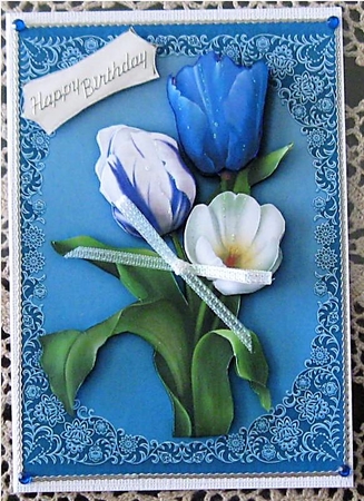 Vibrant Blue Tulips on a Fillagree Mat  by Wendy De Winter