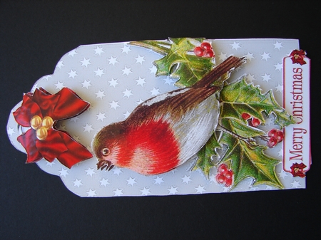 Lovely robin on a silver tag with holly, bow with baubles Featured Gallery Photo