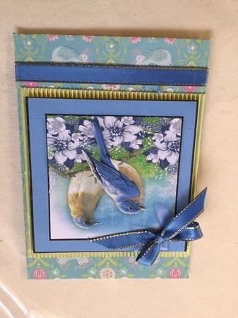 Beautiful Bluebirds and Flowers  by Wynona Oneil