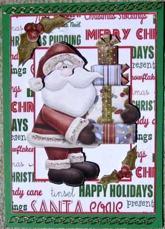 Santa with Pressies and Holly in Frame by Wynona Oneil
