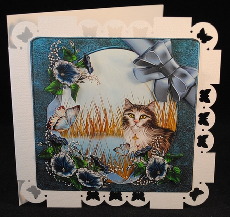 Sweet cat with wrap around blue flowers by Yvonne Middleton
