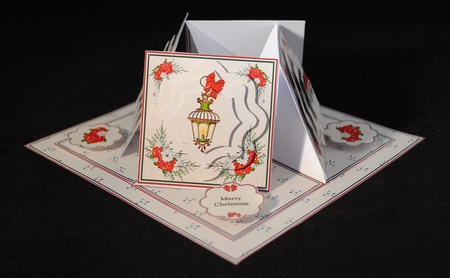 Merry Christmas quad easel card with fancy shaped pyramage. by Yvonne Middleton