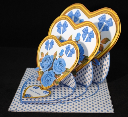 Gold triple heart easel card with blue roses and matching envelope. by Yvonne Middleton