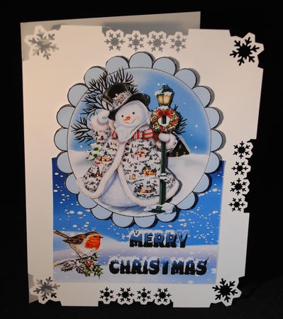 jolly snowman with robin in the snow over the edge by Yvonne Middleton