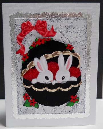 Easter Bunnies in Black/gold Ornate Egg A4 by Yvonne Middleton