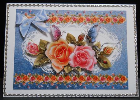 Beautiful Rose Spray on a White Lace Frame by Yvonne Middleton