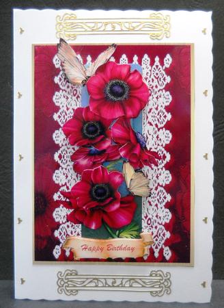Beautiful Red Anemones on a Lace Mat by Yvonne Middleton