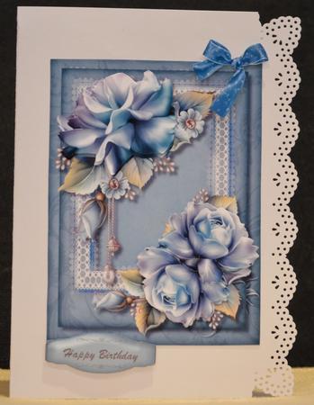 Lovely Blue Porcelain Roses on Lace  by Yvonne Middleton