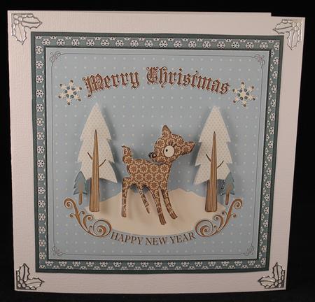 Cute Christmas Deer on Blue Background by Yvonne Middleton