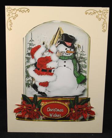 Lovely Snow Globe with Santa Dressing the Snowman  by Yvonne Middleton