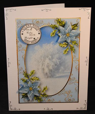 Blue Poinsettias Snowy Tree by Yvonne Middleton