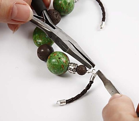A bracelet with stone beads and lava beads.