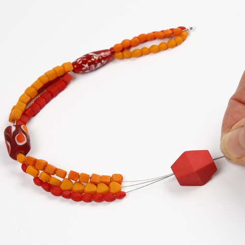 A Necklace with Red Glass Beads