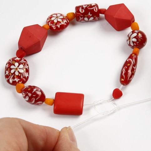 A Necklace with Red Glass Beads