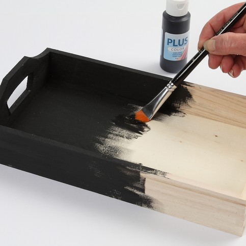 A Wooden Tray with Wooden Discs