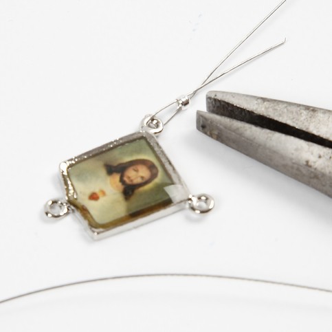 A Pendant of Christ with Wooden Beads